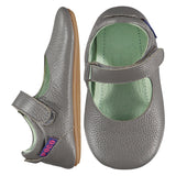 Mighty Shoes Grey Mary Jane. Children's shoe in grey colour leather. Barefoot shoe with self fastening strap and a flat, super flexible TPU rubber sole. The sole has the Poco Nido logo on it. View of top and side. Black friday sale