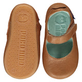 Mighty Shoes Tan Mary Jane. Children's shoe in tan colour leather. Barefoot shoe with self fastening strap and a flat, super flexible TPU rubber sole. The sole has the Poco Nido logo on it. View of top and sole. Poco Nido baby, toddler and childrens shoes make unique gifts - as christmas gifts, stocking fillers, baby shower gifts, new parent gifts, to celebrate new walking skills and many other occasions. They are great toddler shoes too and are perfect for daycare settings.
