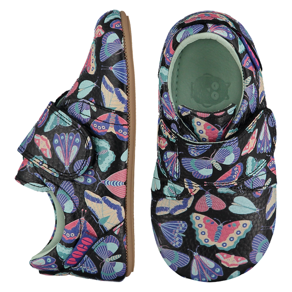 Mighty Shoes. Butterfly Strap Shoes. Black leather strap shoes with a bright butterfly print, leather lined. Poco Nido baby, toddler and childrens shoes make unique gifts - as christmas gifts, stocking fillers, baby shower gifts, new parent gifts, to celebrate new walking skills and many other occasions. They are great toddler shoes too and are perfect for daycare settings.