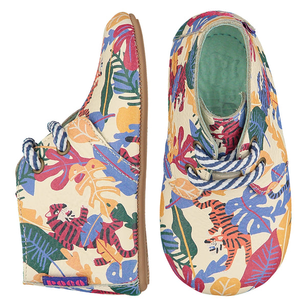 Mighty Shoes Rainbow Tiger Desert Boot. Children's ankle boot in cream leather with colourful jungle tiger print. Barefoot boot with striped laces and a flexible TPU sole. The sole has the Poco Nido logo on it. Poco Nido baby, toddler and childrens shoes make unique gifts - as christmas gifts, stocking fillers, baby shower gifts, new parent gifts, to celebrate new walking skills and many other occasions. They are great toddler shoes too and are perfect for daycare settings.
