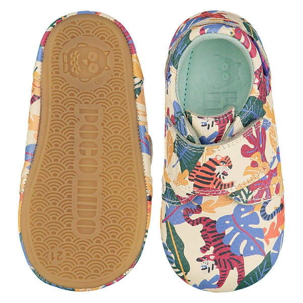 Mighty Shoes Rainbow Tiger Strap Shoe. Children's shoe in cream leather with colourful jungle tiger print. Barefoot shoe with a self fastening strap and a flexible TPU rubber sole. The sole has the Poco Nido logo on it. Poco Nido baby, toddler and childrens shoes make unique gifts - as christmas gifts, stocking fillers, baby shower gifts, new parent gifts, to celebrate new walking skills and many other occasions. They are great toddler shoes too and are perfect for daycare settings.